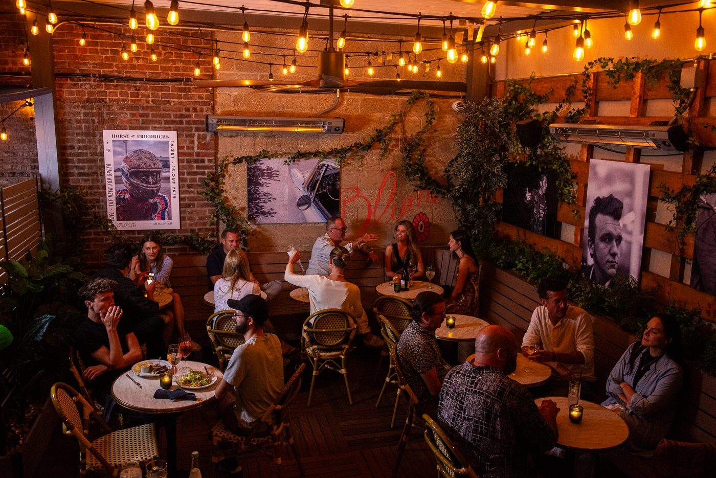 Guests inside Jeremy's — group at a table, warm lighting